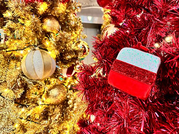 istock Luxurious, sparkling red and gold Christmas trees, adorned with decorations. 2252406935