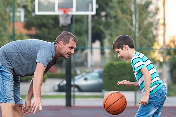 istock Parent and Son in Active Basketball Play 2252407869