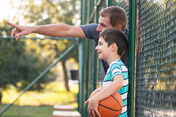 istock Casual Basketball Moment Between Father and Son 2252408055