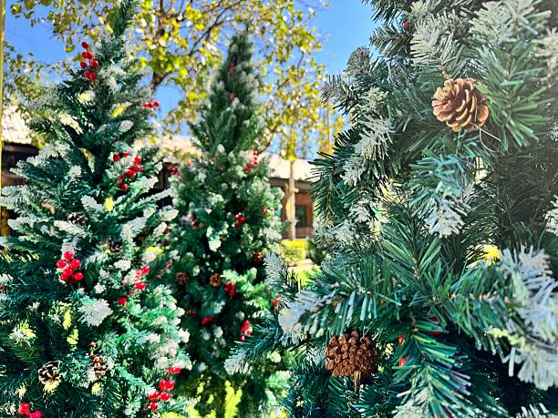 istock Outdoor artificial Christmas trees with colorful decorations. 2252409225