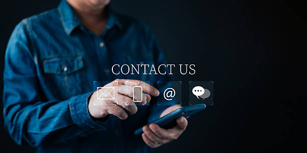 istock A person uses a smartphone while selecting virtual contact icons on a sleek digital interface, highlighting modern communication options,email access,and seamless customer support connectivity. 2252412186