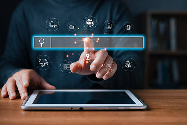 istock A person uses a tablet with a glowing virtual search bar surrounded by digital icons symbolizing internet,engine,cloud,data,AI,location,and security,highlighting modern search engine technology. 2252412772