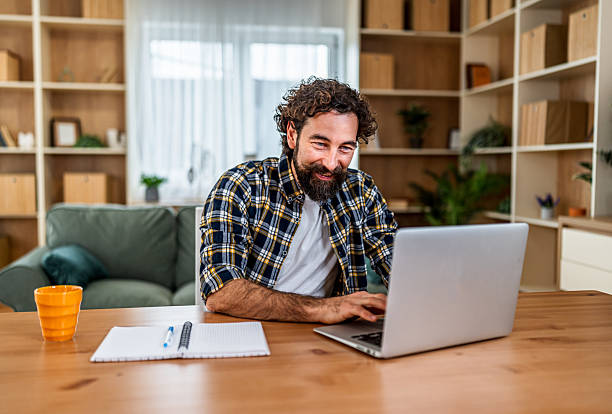 istock Happy man working remotely from home office 2252414393