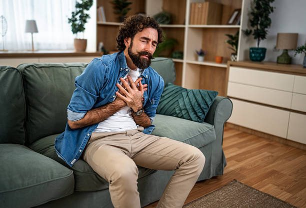 istock Man suffering acute chest pain at home on couch 2252416227