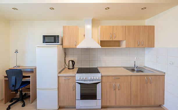 istock Minimalist Small Kitchen with Wooden Cabinets and Modern Appliances 2252418086