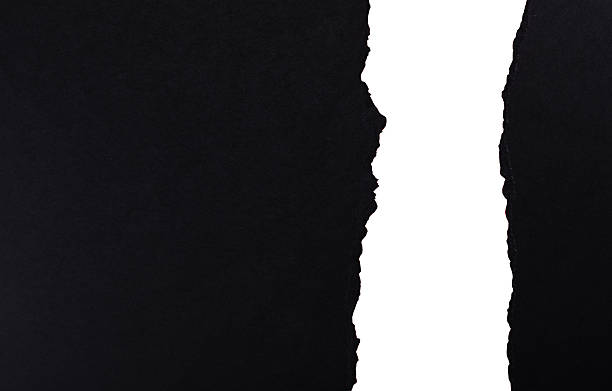 istock Torn paper creating a contrast between black and white sides. 2252418618