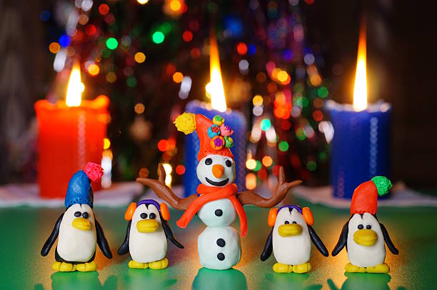istock Toy penguins and a snowman. 2252418672