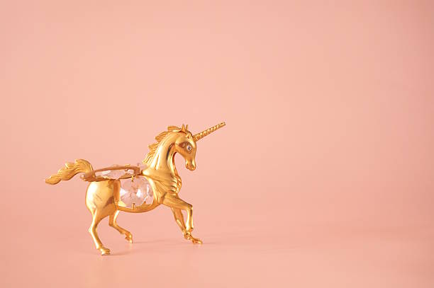 istock A unicorn figurine on a pink background. 2252419141