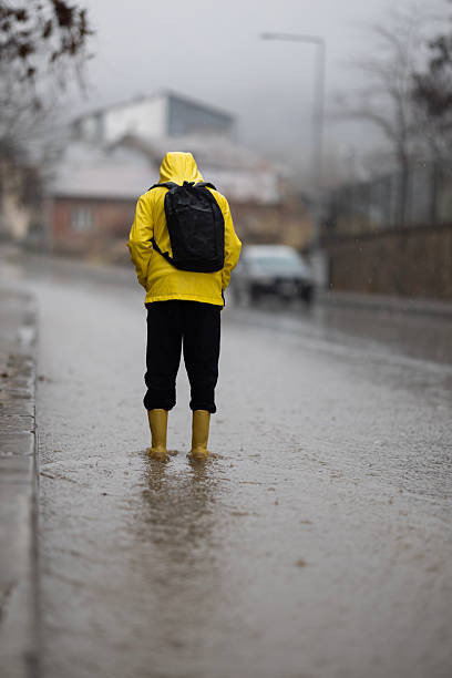 istock A boy going to school on a rainy day 2252420240