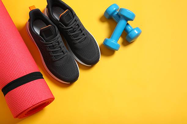 istock Sport equipment on color background, top view 2252420911