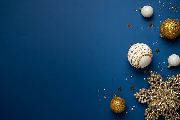 istock White and golden Christmas decorations on navy background. 2252420982