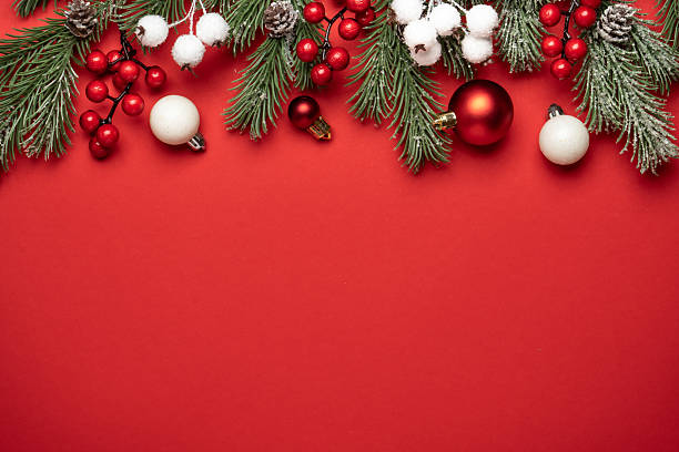 istock Christmas decorations and fir tree branches on red background. 2252421245