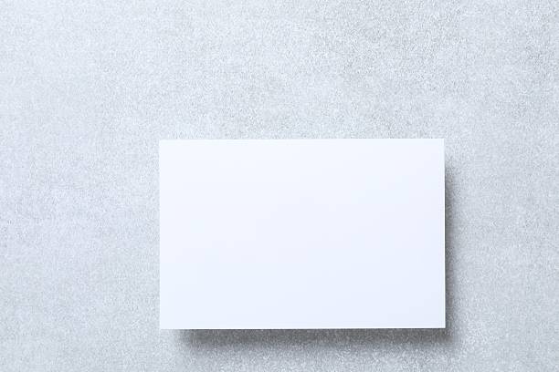 istock Top view photo with with white paper card on grey background 2252423026