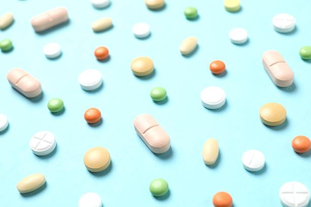 istock Various medical pills on a colored background 2252424522