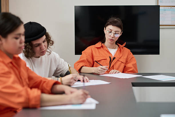 istock Young Adult Women Studying Together during Prison Education Program 2252426497