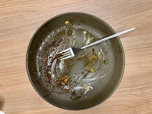 Empty Ceramic Plate With Spoon Crumbs, Olive Green Glaze, Thin Sauce Streaks On Wooden Tabletop, Soft Morning Light, Cozy Minimal Aesthetic, Subtle Texture And Glossy Finish, Scene Suggests