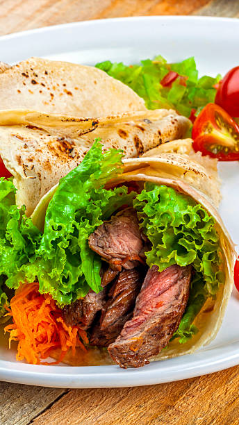 istock Wrap, tortillas filled with meat and vegetables. 2252428956