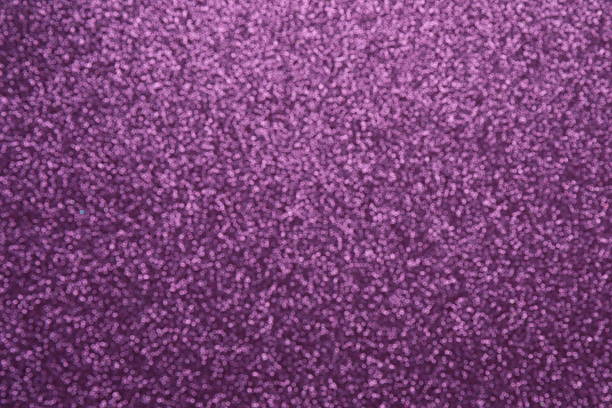 Abstract background. Shiny blurred purple glitter texture