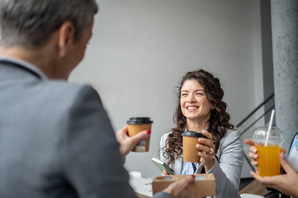 istock Business colleagues enjoying coffee break and friendly conversation 2252432991