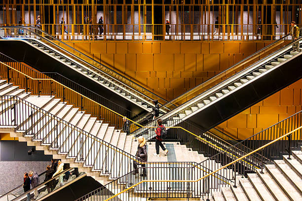 Stairs and escalators inside Colosseo–Fori Imperiali Metro C station, Rome, Italy.