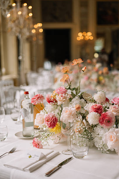 Elegant wedding reception table setting with floral centerpiece