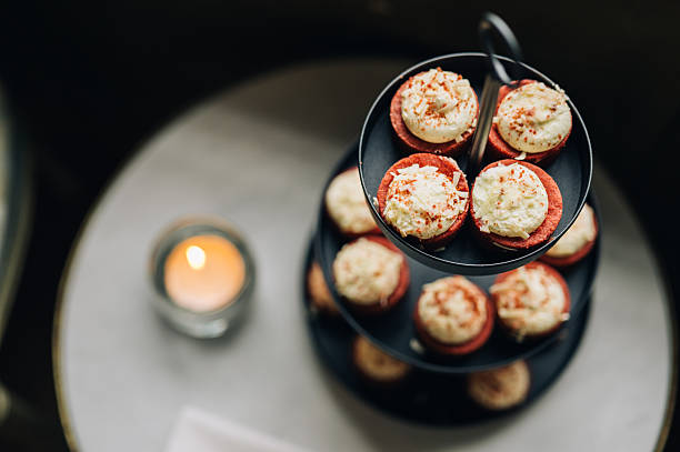 istock Savory macarons with cream filling on tiered stand 2252435833