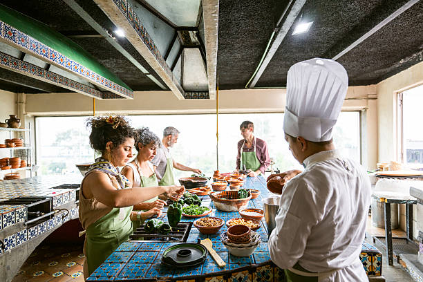 istock Chef shows tourists how to cook Mexican dish 2252437245