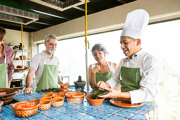 istock Chef shows tourists how to cook Mexican dish 2252437941