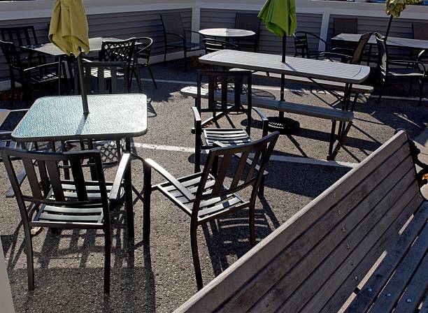 Mackinaw City cafe table and chairs with reflected light.