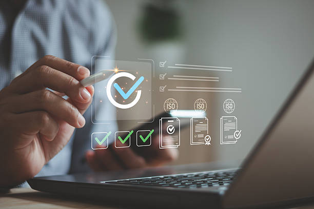 istock Quality assurance and compliance concept. Businessman using digital pen on laptop, checking checklist ISO document. Business standard, certification process, data validation, quality control system. 2252440515