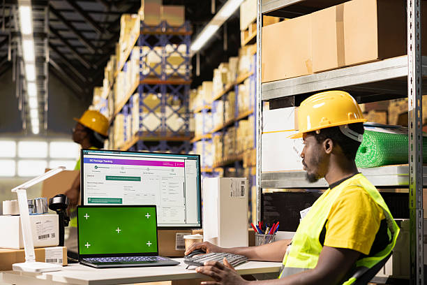 istock Huge distribution center worker verifying parcel details with isolated display 2252441659