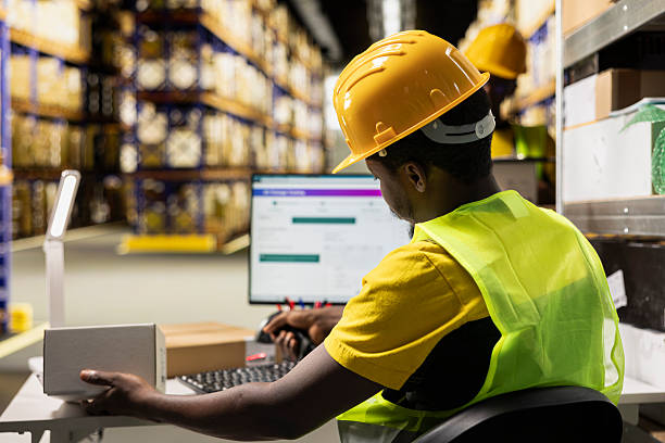 istock Retail distribution hub staff scanning barcode awb labels on boxes 2252441919