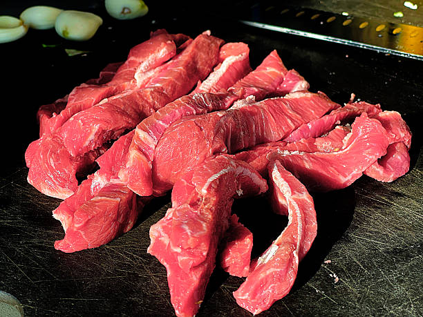 Shredded steak on a cutting board