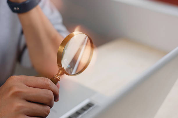 istock businessman looking at data chart dashboard in concept of investment data analysis and DMS document audit financial Tax Fraud audit Using Magnifying Glass. 2252445704