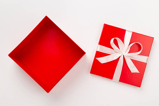 istock Open red gift box on color background, top view 2252447340