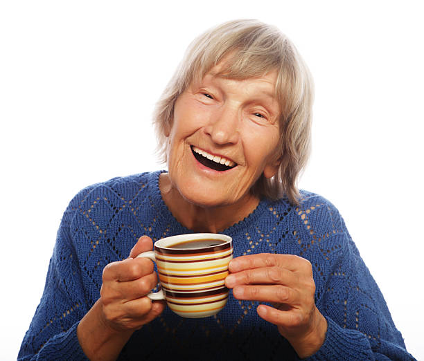 istock Happy old lady with coffee 2252450275