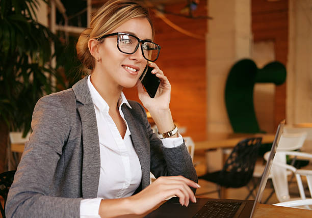 istock Happy woman using chatting with mobile and use laptop computer 2252451724