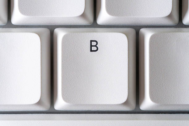 Close-up of the B key on a white keyboard