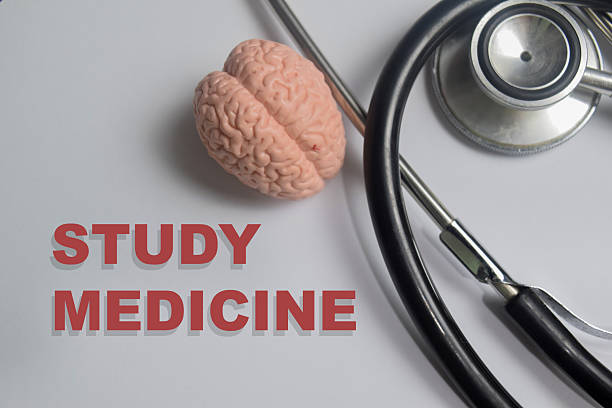 istock Concept of study medicine write on book isolated on Wooden Table. 2252452265