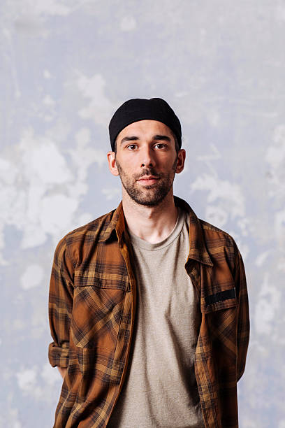 istock Casual man in plaid shirt and cap 2252453039