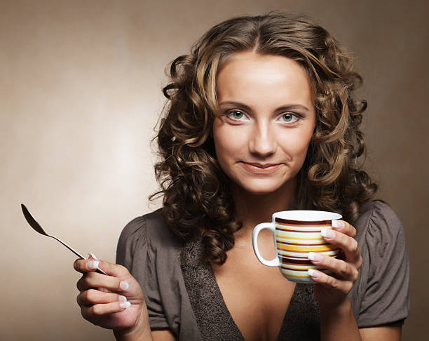 istock pretty woman drinking coffee 2252454805
