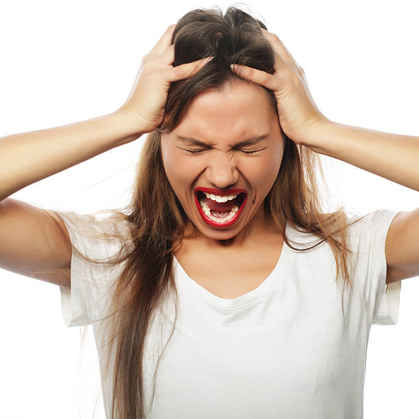 istock frustrated and angry woman screaming. 2252456084