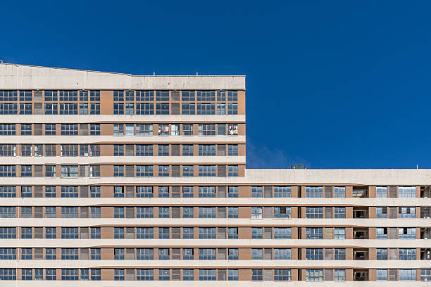 modern buildings made of metal and glass of various shapes against a blue sky in Prague, Pankrac district