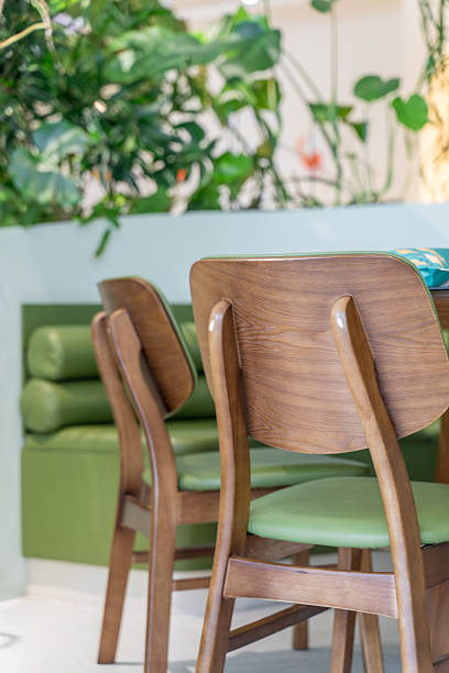 istock Green dining table and wooden chairs 2252467677