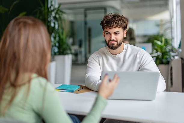 istock Colleagues discuss project details in modern office space during working hours 2252468554