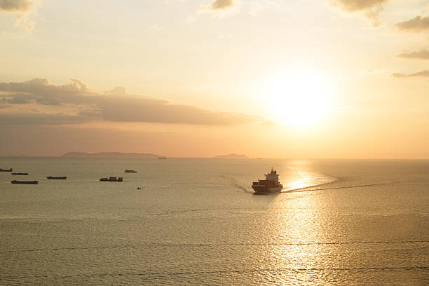 Small ship entering the port at sunrise