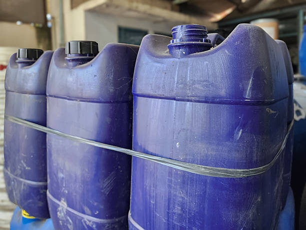 istock Plastic jerrycan containers in bulk, blue industrial canisters for liquid storage and transportation in indoor setting 2252477519