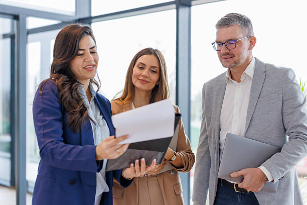 istock Business colleagues discussing documents during meeting in office 2252483759