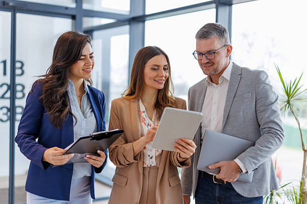 istock Business colleagues collaborating on digital tablet in office 2252483764