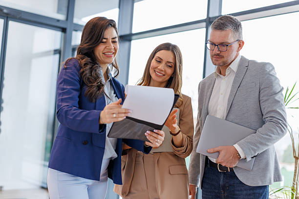 istock Business colleagues discussing documents in modern office meeting 2252483845